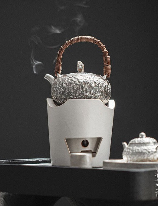 This is a gilted silver kettle 