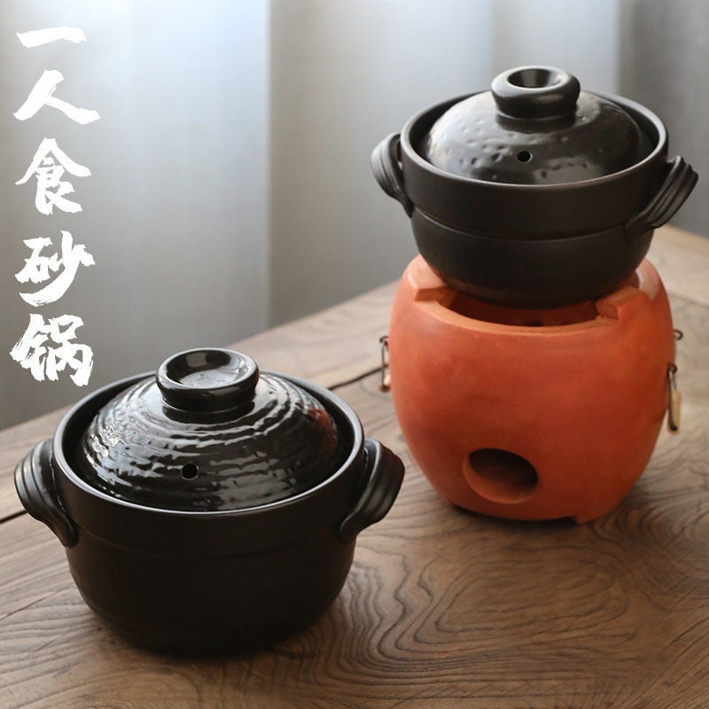 this is a pottery cooking pot