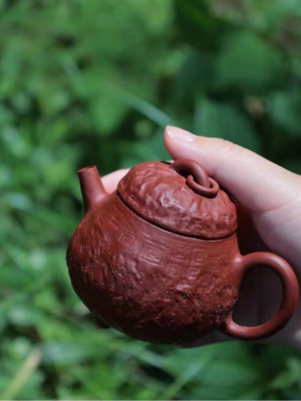 This is a purple clay teapot