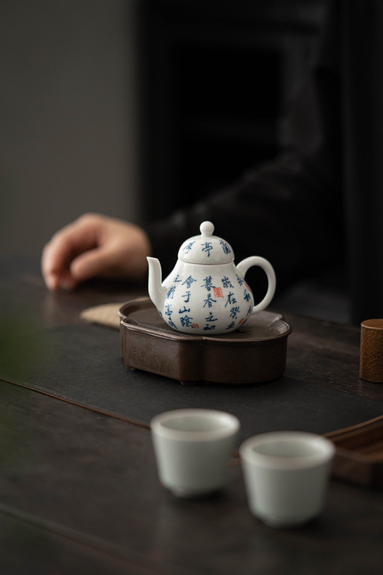 This is a white ceramic teapot