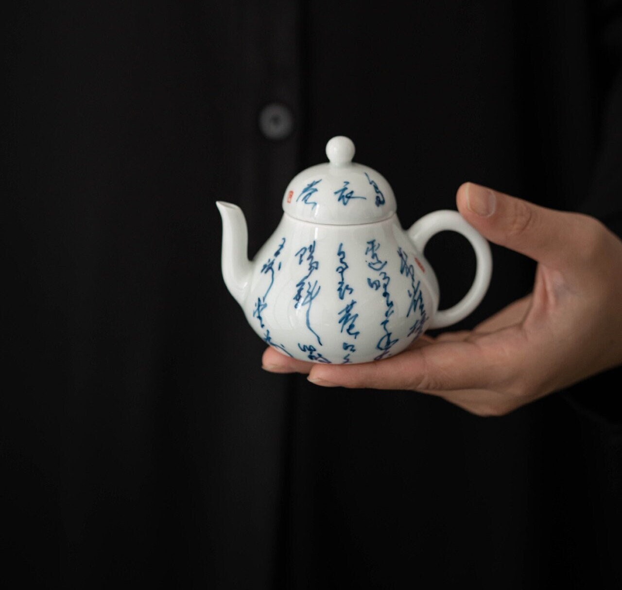 This is a white ceramic teapot