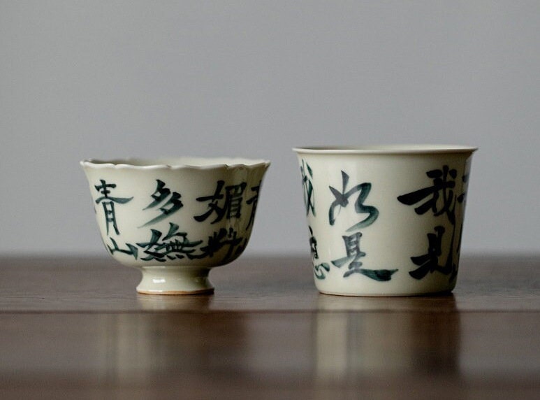 This is a ceramic teacup.this is wood ash glaze teacup