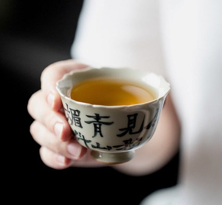 This is a ceramic teacup.this is wood ash glaze teacup