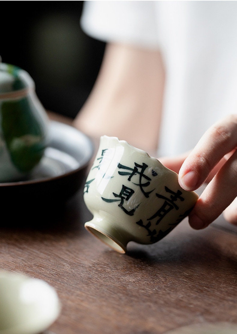 This is a ceramic teacup.this is wood ash glaze teacup