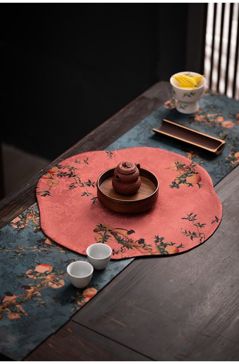 This is a silk brocade tea mat.this is a waterproof table cloth