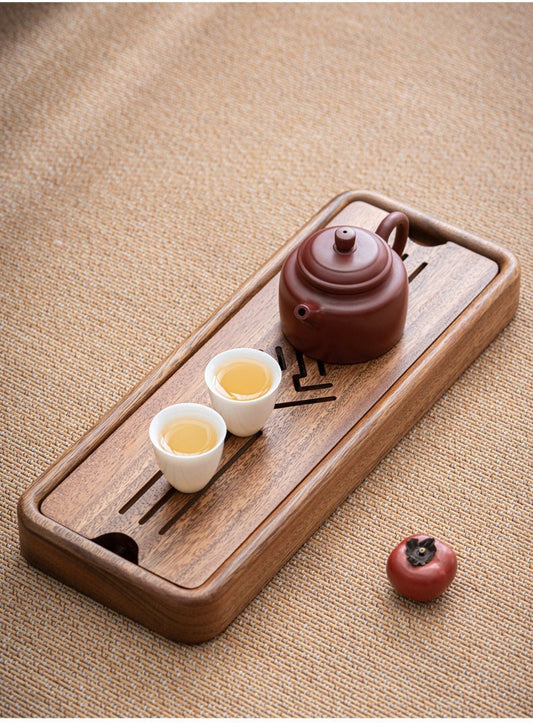 this is a walnut tea tray tea boat