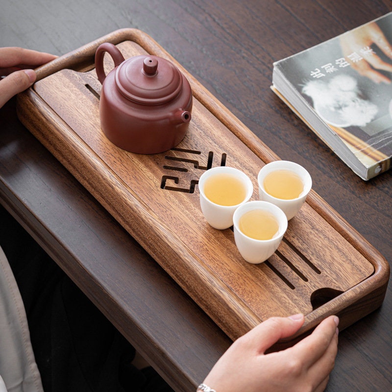 this is a walnut tea tray tea boat