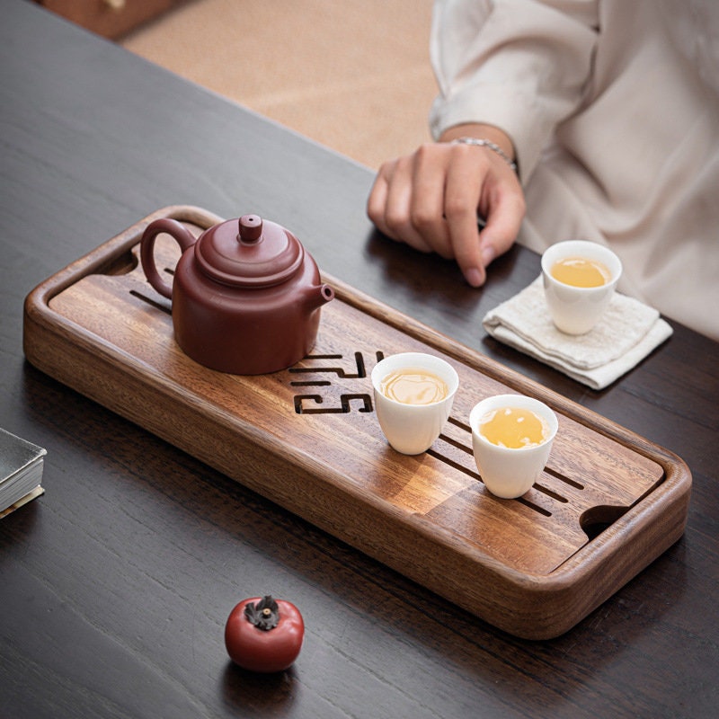 this is a walnut tea tray tea boat